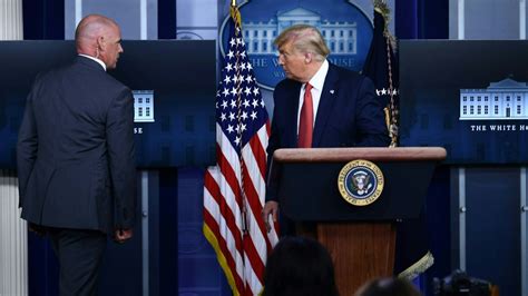 president trump is escorted from press briefing by secret service