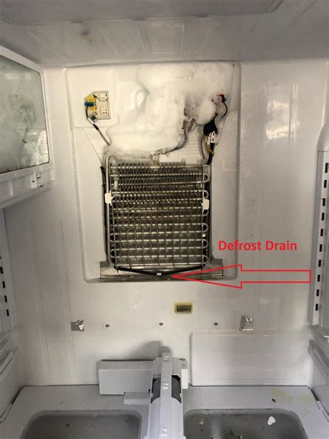refrigerator defrost drain  clogged repair guide