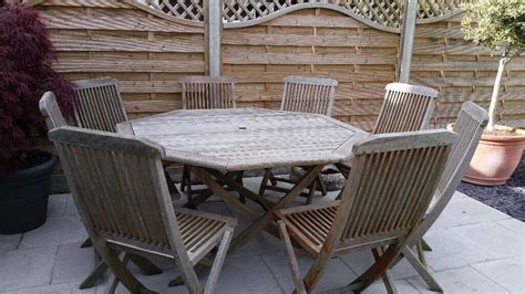 wooden octagonal garden table   chairs provisionally