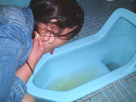 beaver hunt asian in blue jean coat licking asian toilet with piss