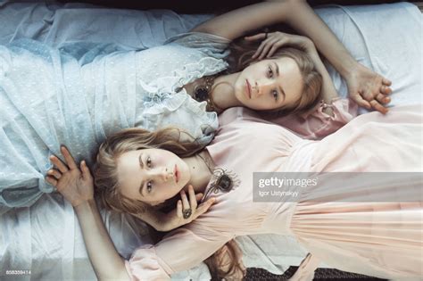portrait of two women on the bed photo getty images
