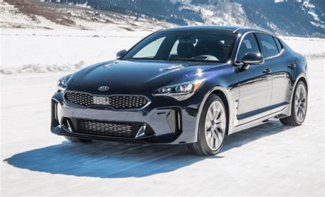 kia stinger delivers sharp performance  head turning styling