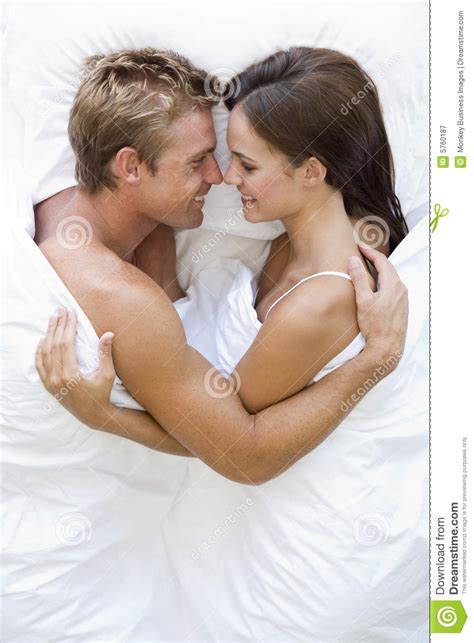 Couple Lying In Bed Smiling Stock Image Image Of Couple