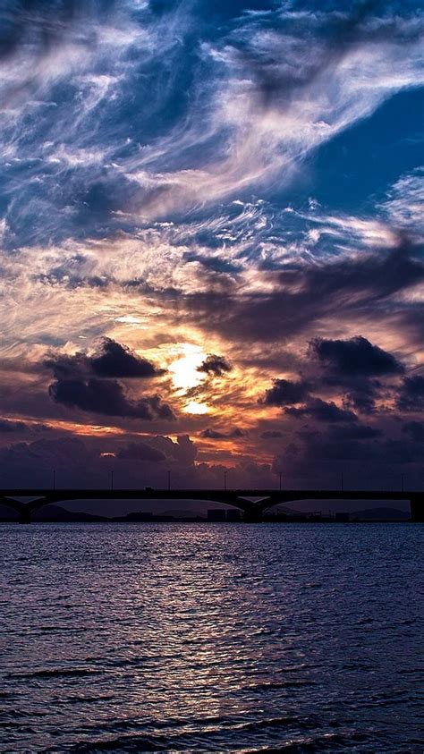 dramatic clouds sunset over bridge iphone 6 wallpaper hd