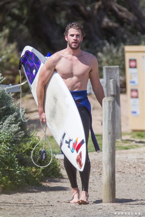 Liam Hemsworth Shirtless While Surfing In Australia