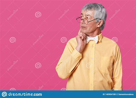 Thoughtful Old Man With Black Rounded Glasses On Nose