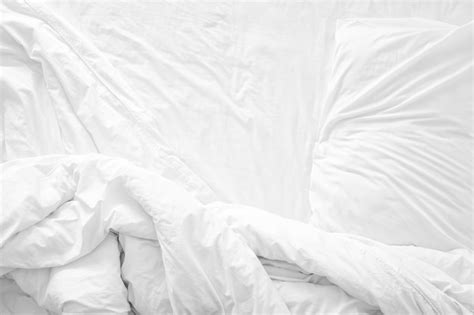 premium photo top view   bedding sheets  pillow