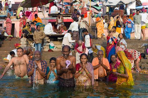 hindu pilgrims bathing in river ganges varanasi india