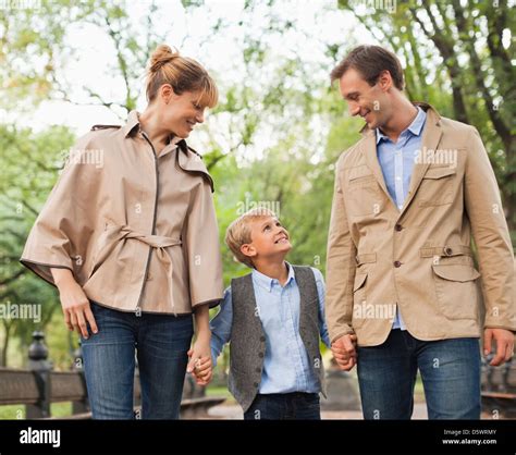 family walking   park stock photo alamy