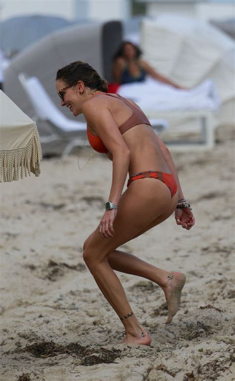 katie cassidy wearing an orange color thong bikini in miami 18 celebrity