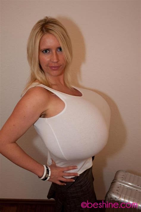 beshine in white tank top and skirt at home the boobs blog