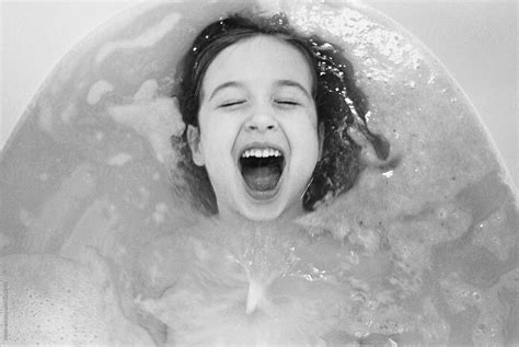 Cute Young Girl Playing In A Bathtrub By Stocksy Contributor Jakob