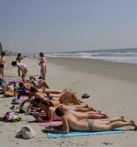 varsity tanning team hard at work at the beach williams