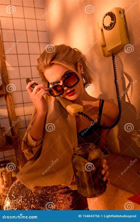 Beautiful Elegant Woman In Sunglasses Talking On Retro Telephone And