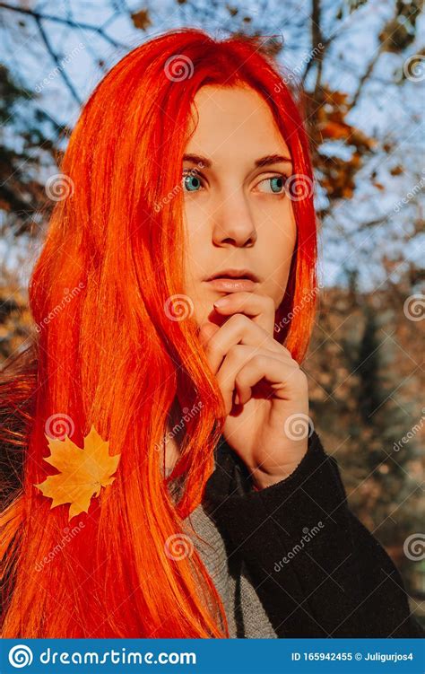 beautiful redhead girl with long strong and thick hair perfect woman