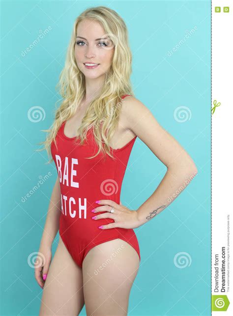 Beautiful Lifeguard Wearing A Red Swimsuit Stock Image
