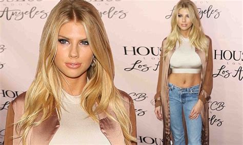 charlotte mckinney flashes tummy in crop top at store opening in west hollywood daily mail online