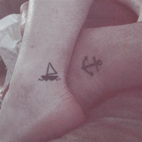 matching tattoos couple tattoo sailboat and anchor