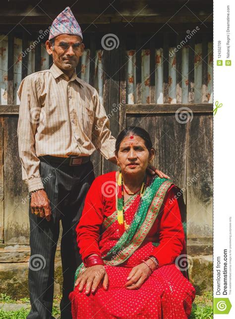 a beautiful nepali couple posing for photograph in the rural vil