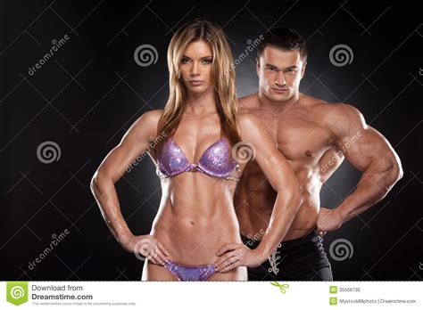 Sexy Couple Of Fit Man And Woman Showing Muscular Royalty Free Stock