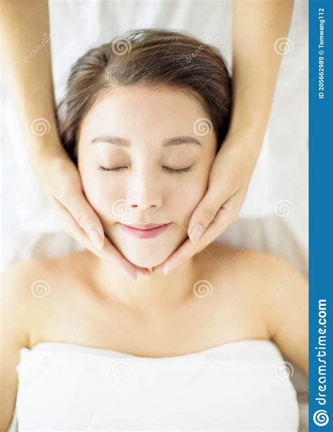 Relaxed Beautiful Young Woman Enjoy Massage In Spa Salon Stock Image