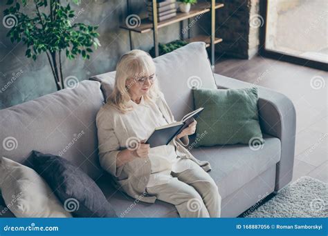 Photo Of Blond Adorable Aged Granny Sitting Comfy Sofa Divan Reading