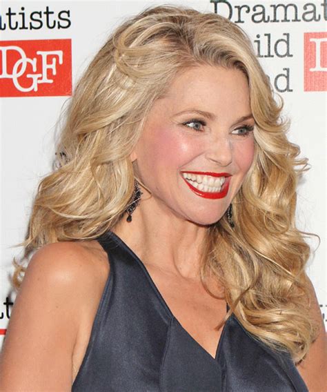 christie brinkley long wavy hairstyle with light blonde highlights