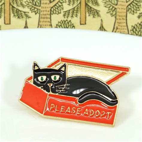 metallic pin adopt  cat