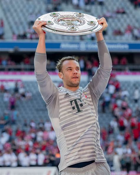 munich germany   goalkeeper manuel neuer  fc bayern muenchen lifts  trophy