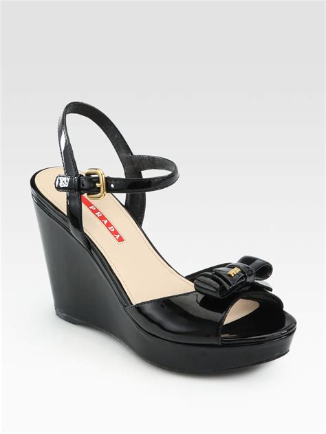Prada Patent Leather Bow Wedge Sandals In Black Lyst