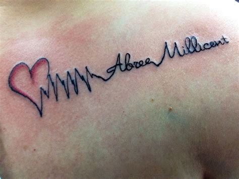 my daughter s actual heartbeat and name upper chest tattoo small rib