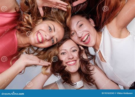 Three Happy Woman Friends Looking Down Stock Image Image Of Brunette
