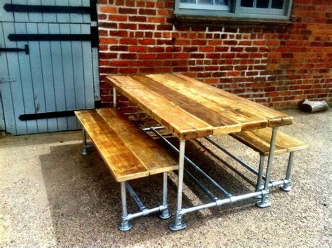 large reclaimed scaffold dining table  benches