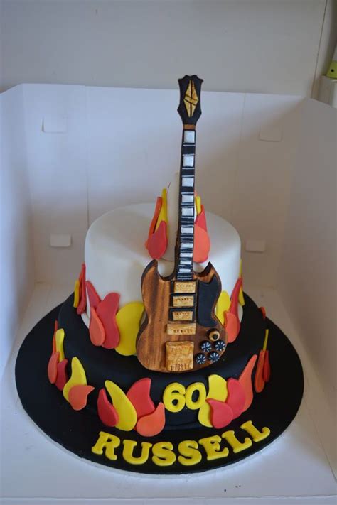 rock  roll themed flames guitar cake   guitar