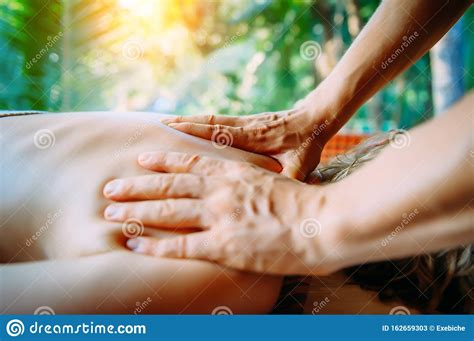 acupressure massage in spa centre outdoor woman at acupressure back