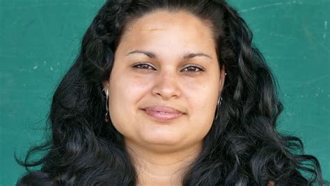 Portrait Of Overweight Hispanic Woman Looking At Camera And Smiling