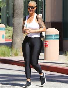 amber rose squeezes her curves into tight top and leggings as she grabs a coffee to go daily