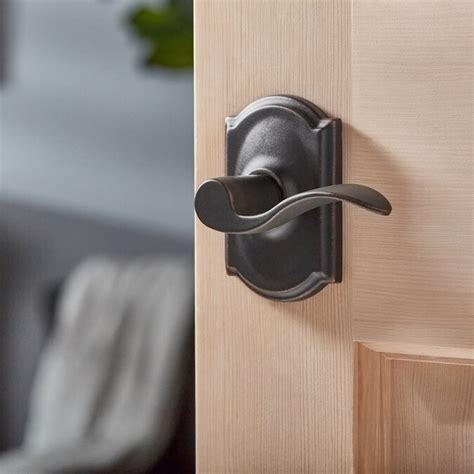schlage accent  camelot trim aged bronze reversible passage door handle   door handles