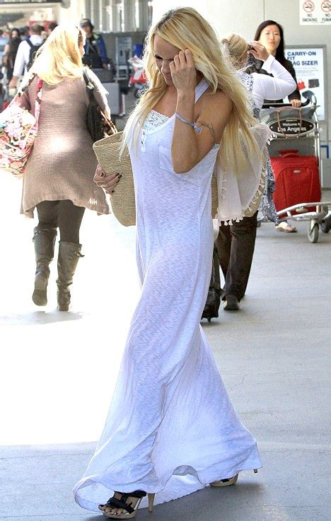 Watch Out Pamela Anderson Jets Into La In See Through White Dress