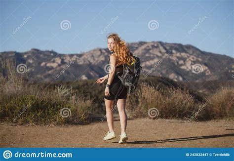 Backpacking Tourism Concept Woman Hiker With Backpack Climbed A Hill