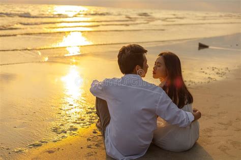 Couple In Love Watching Sunset Together On The Beach Travel Summer