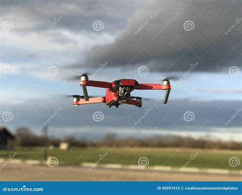 drone flying  cloudy skies picture image