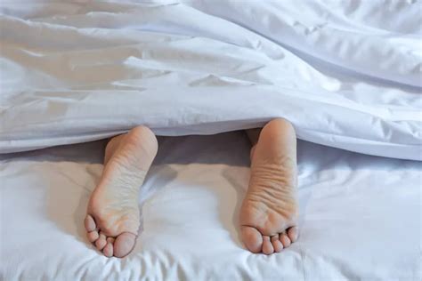 Feet Of Sleeping Woman In White Bed Room Stock Image Everypixel
