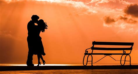 romantic couple embracing  enjoying  sunset