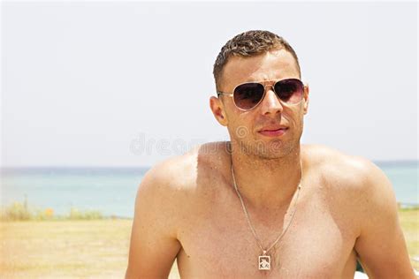 portrait   attractive young man   beach stock image image