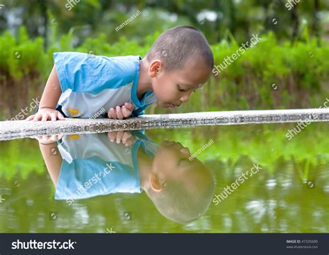 child plays   reflection stock photo  shutterstock