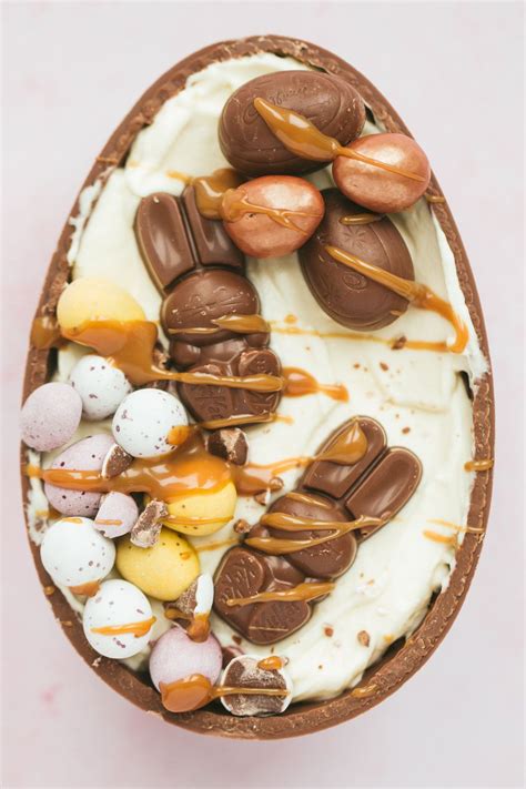 an easter egg filled with chocolate eggs and marshmallows