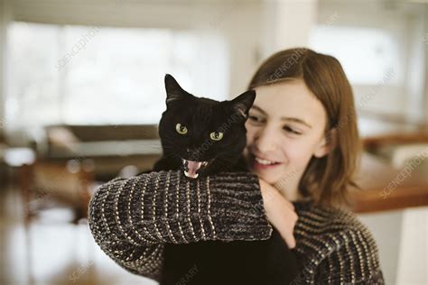portrait girl holding hissing black cat stock image f024 2334