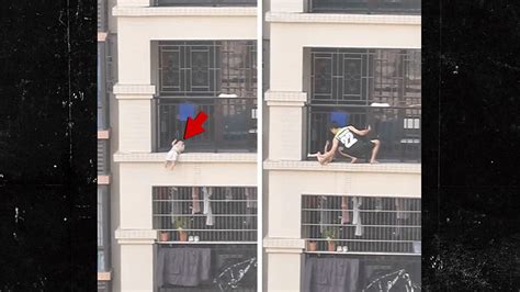 child dangling  balcony rescued  china