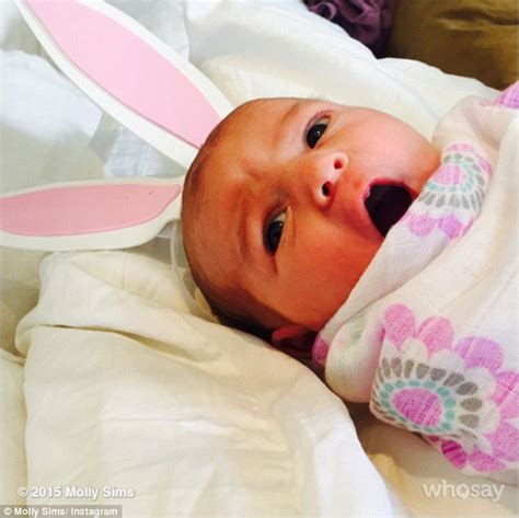 molly sims dresses her newborn up while gisele bundchen s